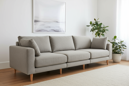 Modern grey fabric sofa, 3-seater modular design, clean lines, Scandinavian style, low profile with wooden legs, neutral grey upholstery, minimalist aesthetic, white background or light minimal room setting, professional product photography, contemporary Australian furniture, comfortable and stylish